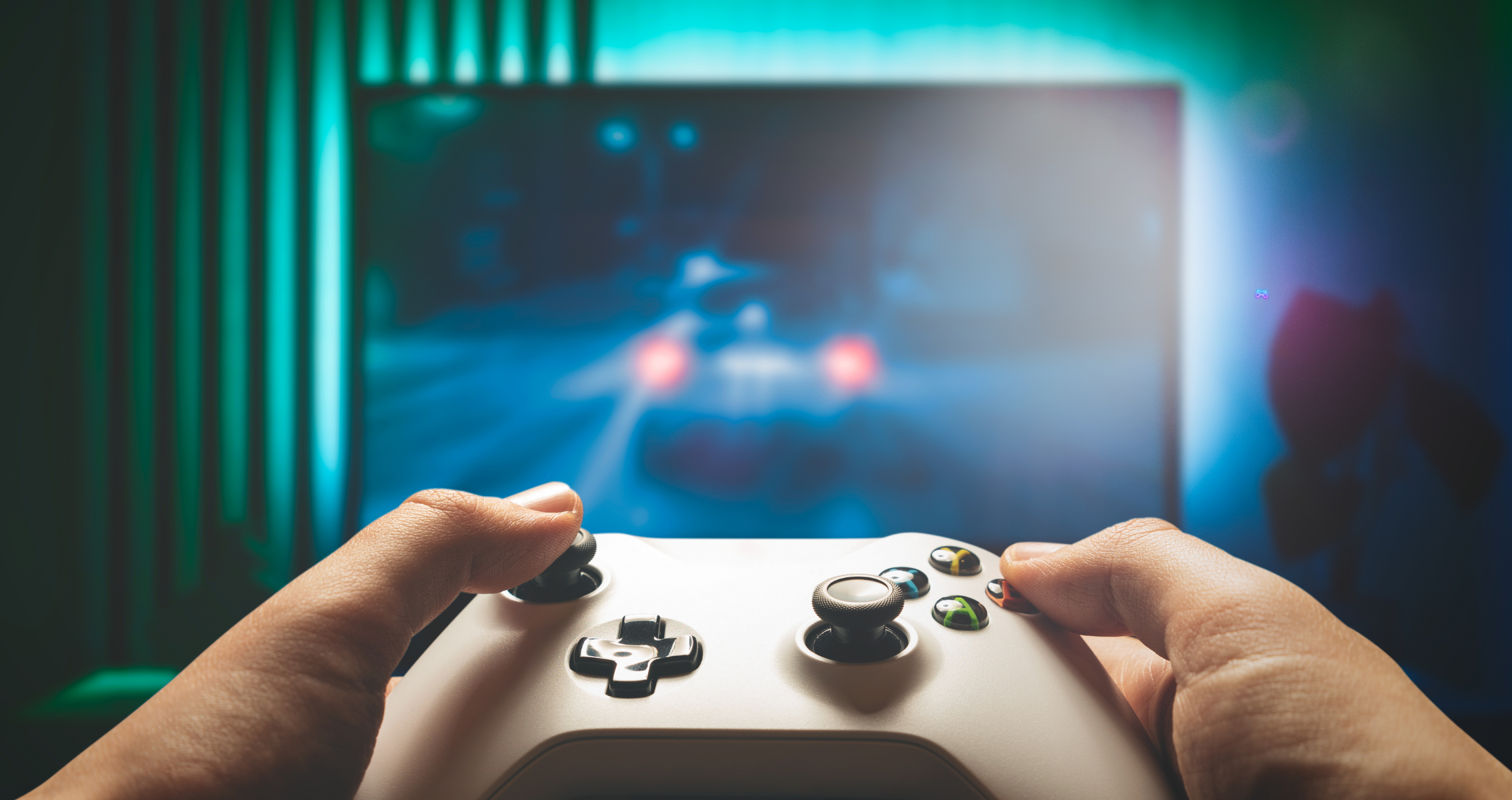 Hands playing on a gaming console joystick